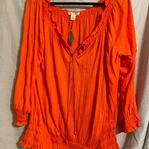 Lightweight, adjustable neckline. 1X orange.